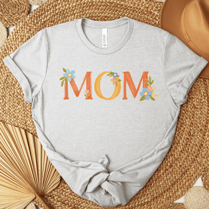 Ash Bella+Canvas 3001 t-shirt with floral MOM lettering in warm oranges and blues