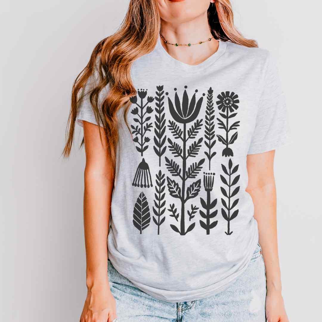 Ash Bella+Canvas 3001 tee with minimal folk floral graphic in dark silhouette