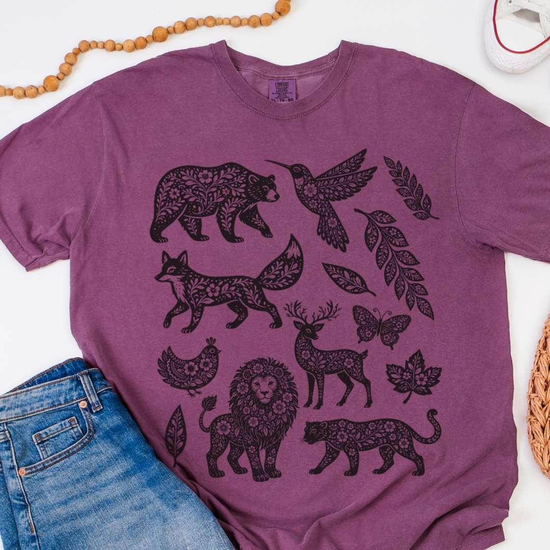 Berry Comfort Colors 1717 tee with woodland animals graphic in dark silhouettes