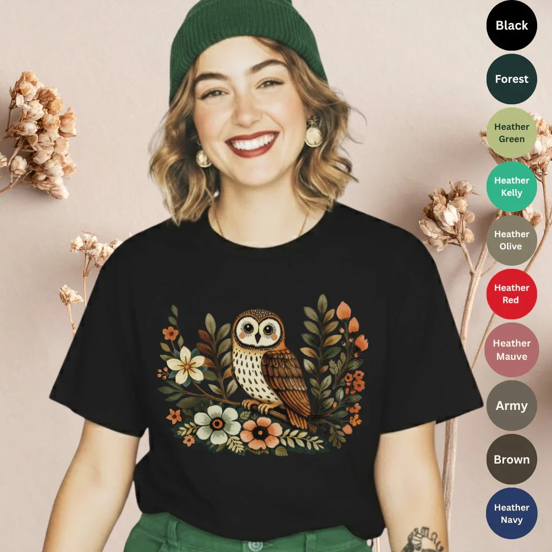 Black Bella+Canvas 3001 t-shirt with vintage boho owl graphic surrounded by wildflowers in earthy tones