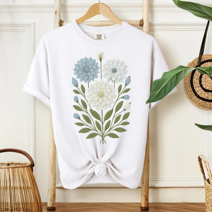 Blue bloom faux embroidery folk art print on white cotton tee — muted blue cream and olive garden design