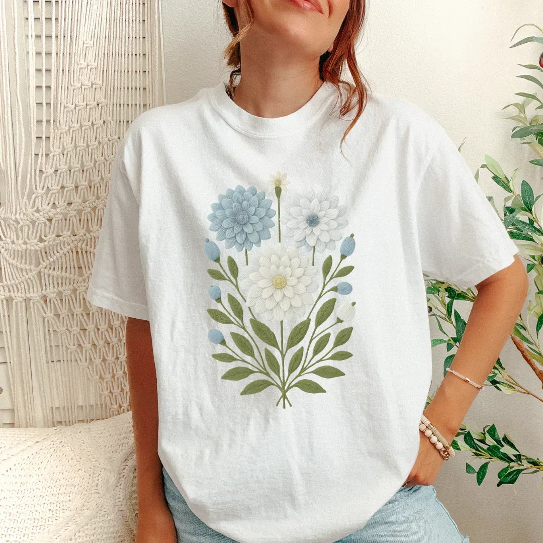 Faux embroidery blue and cream bloom garden print on white tee — folk art stitched look floral shirt