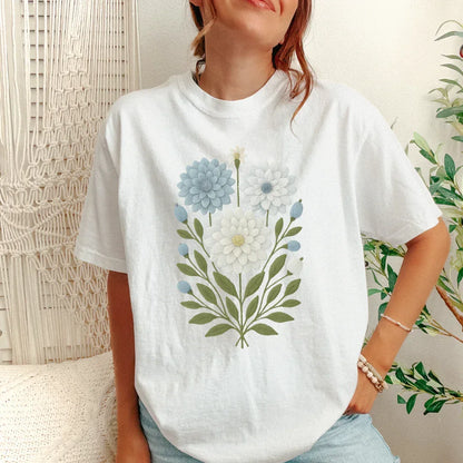 Faux embroidery blue and cream bloom garden print on white tee — folk art stitched look floral shirt
