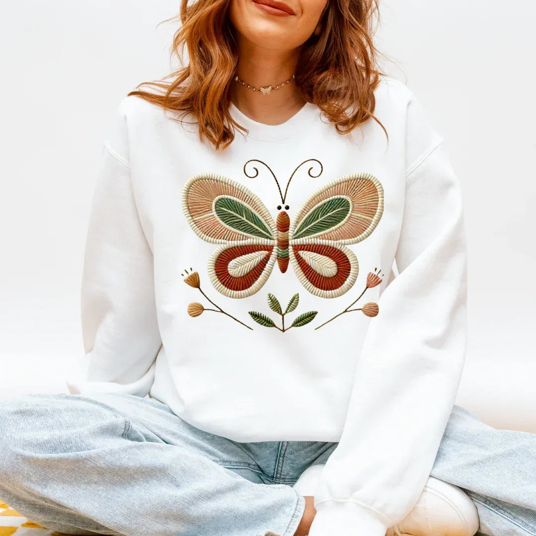 Faux embroidery butterfly sweatshirt in white styled casually — folk art crewneck by The Folk Brush