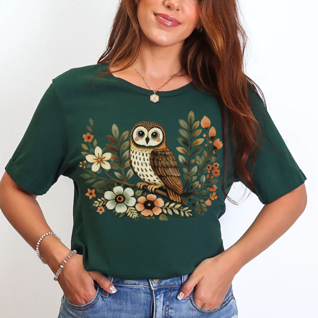 Forest green Bella+Canvas 3001 tee with barn owl and floral illustration in warm autumnal colors