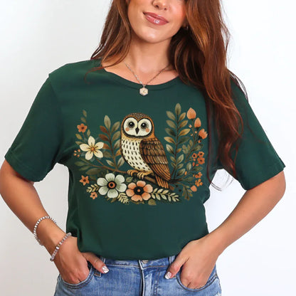 Forest green Bella+Canvas 3001 tee with barn owl and floral illustration in warm autumnal colors