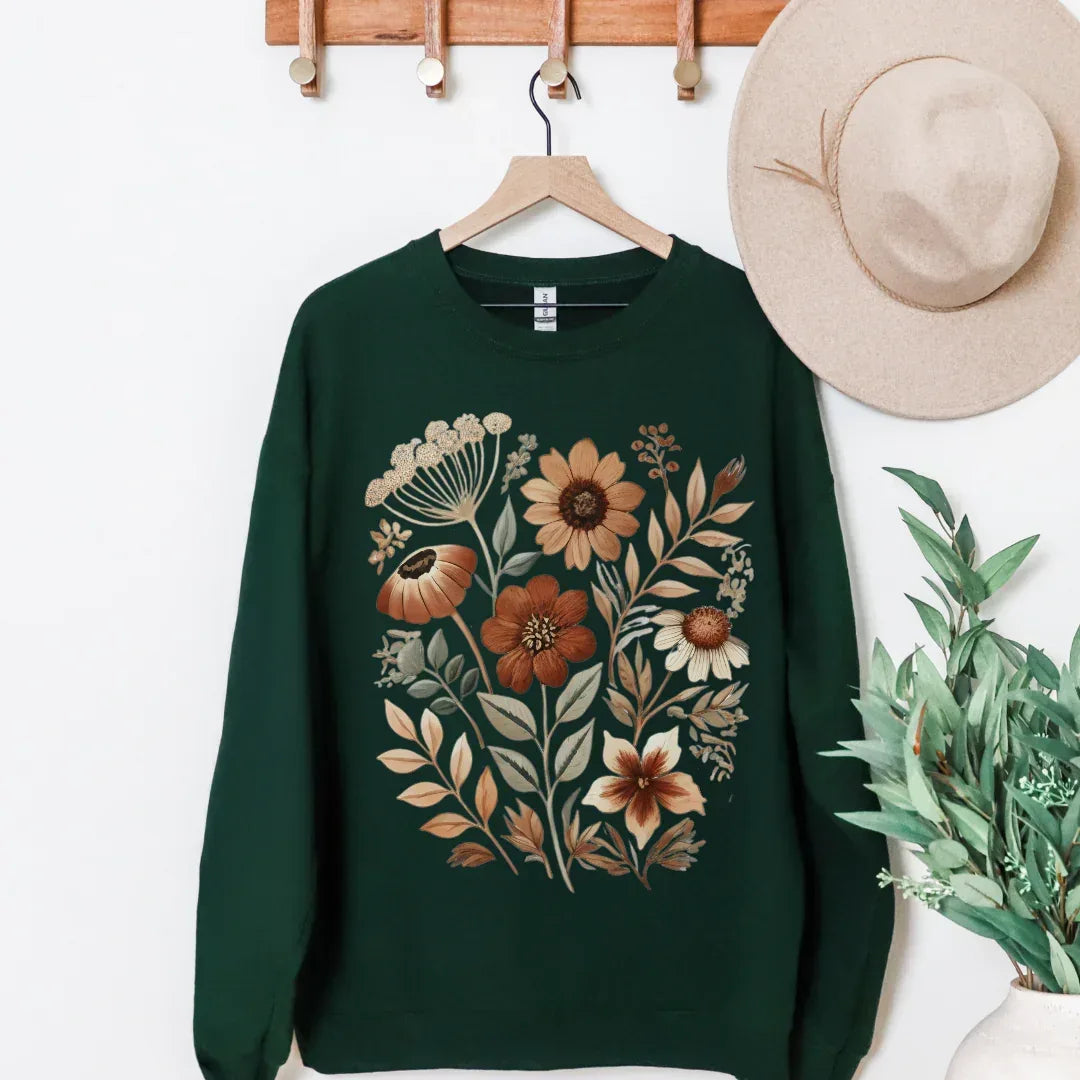 Hand-painted vintage autumn floral folk print on black crewneck sweatshirt — rust cream earthy tones