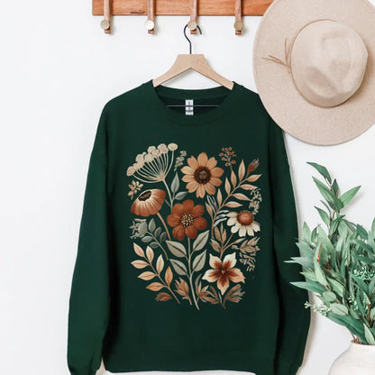 Hand-painted vintage autumn floral folk print on black crewneck sweatshirt — rust cream earthy tones