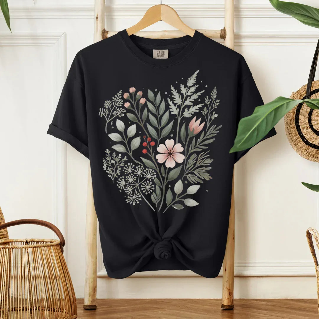 Hand-painted woodland leaves and blush flower folk art print on black garment-dyed tee