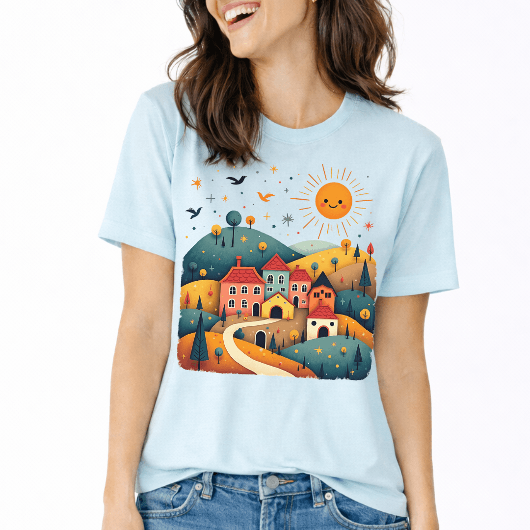 Heather ice blue Bella+Canvas 3001 tee with folk village scene illustration