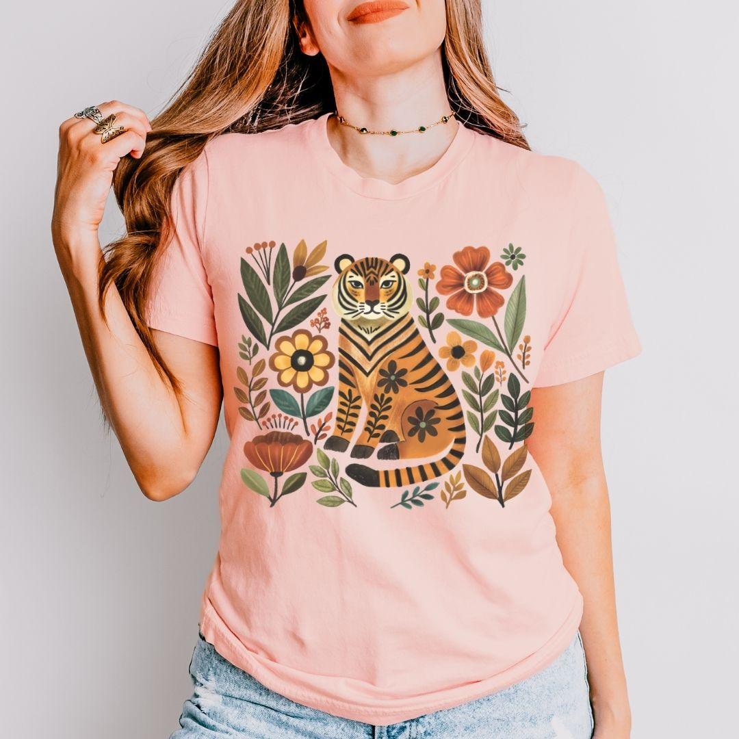 Heather peach Bella+Canvas 3001 tee with folk tiger and wildflower illustration