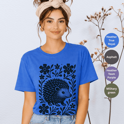 Heather true royal Bella+Canvas 3001 t-shirt with folk hedgehog linocut graphic and floral frame in black ink
