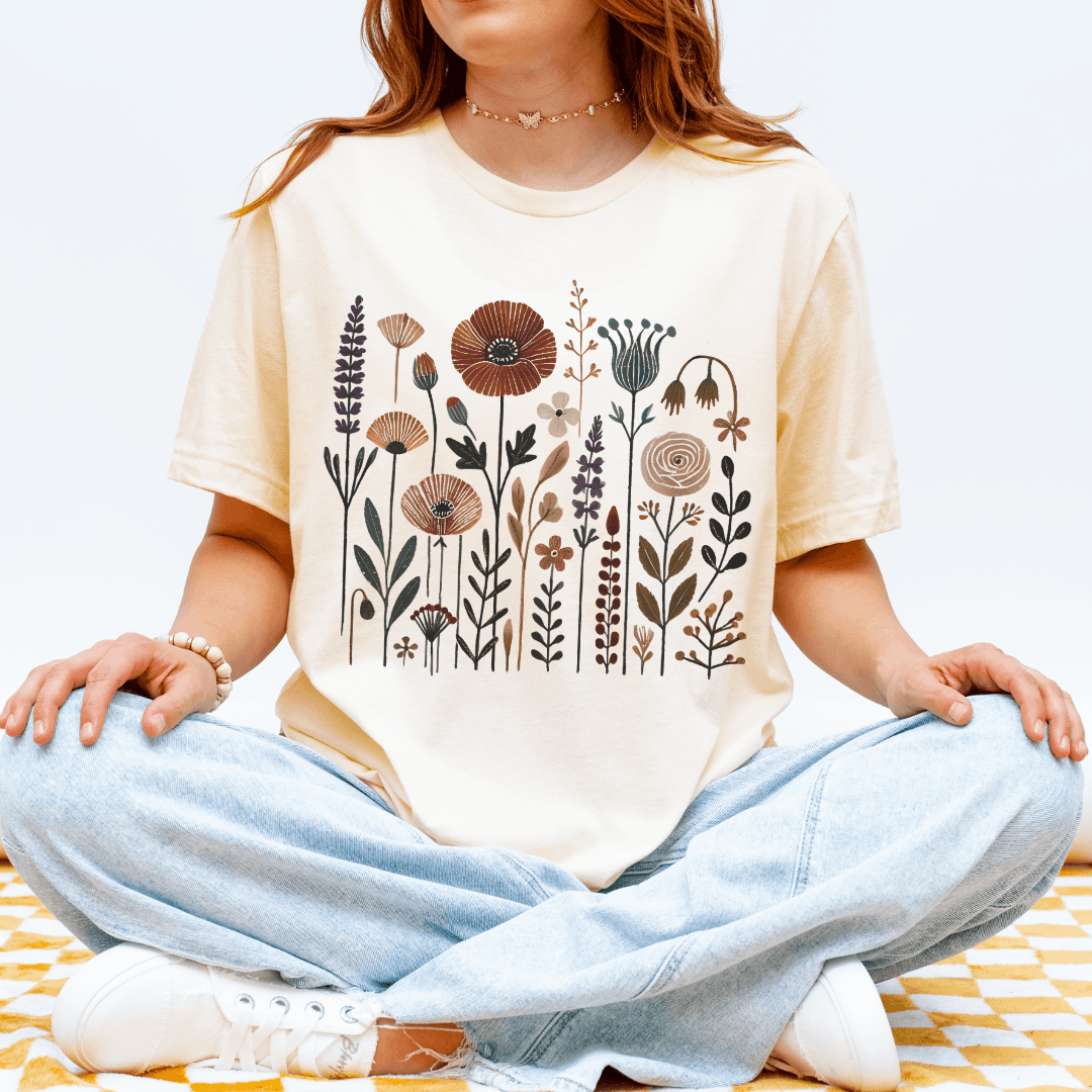 Natural Bella+Canvas 3001 t-shirt with folk wildflower meadow design in earthy colors