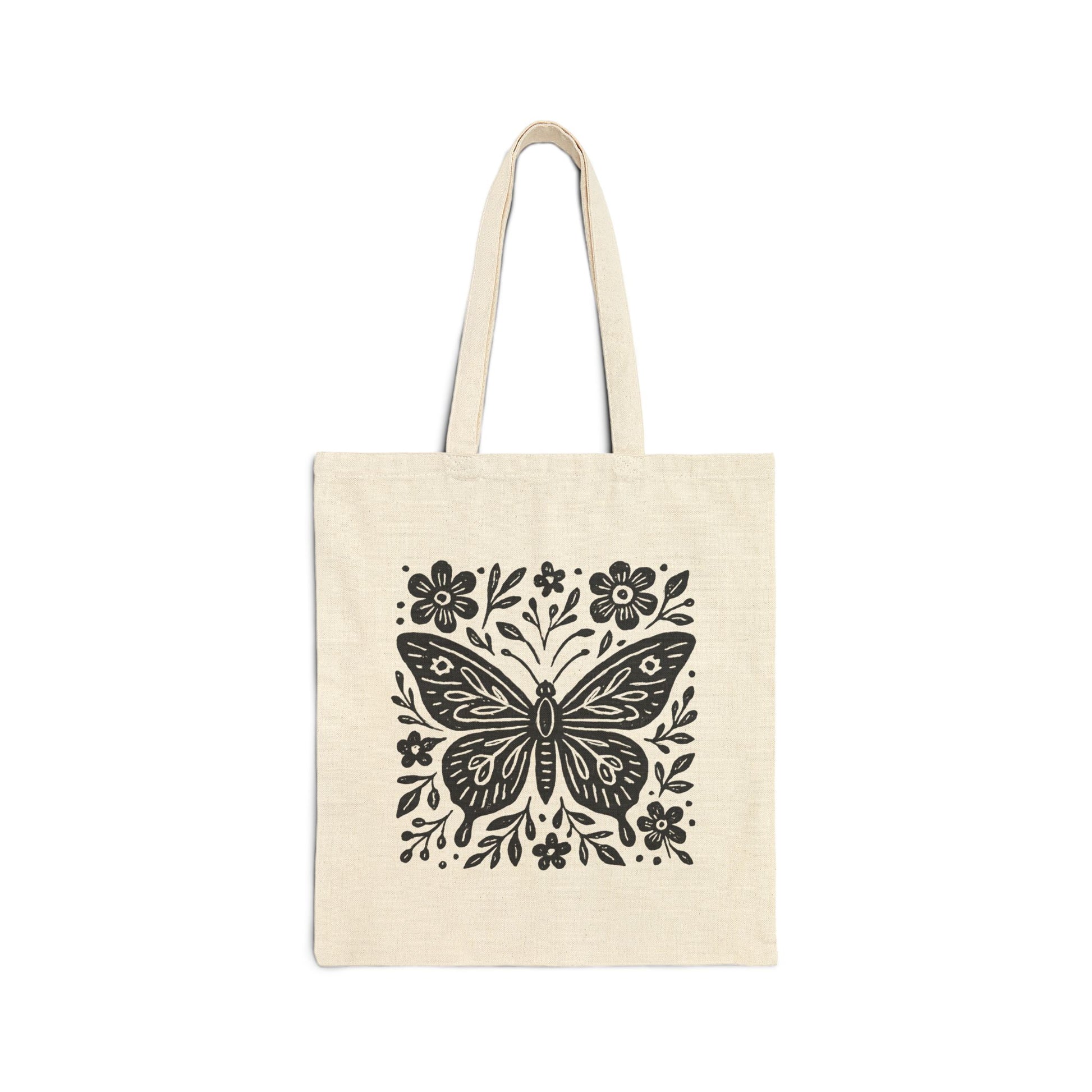 Natural canvas cotton tote bag with bold black folk art butterfly and floral graphic