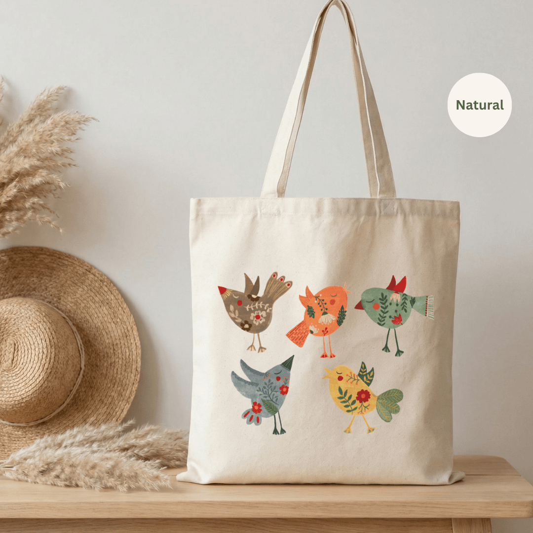 Natural canvas cotton tote bag with three folk art birds illustration in warm reds, teal and yellow