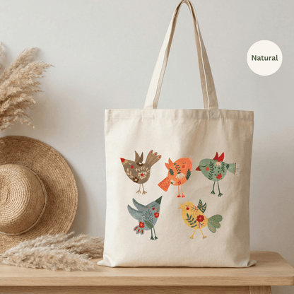 Natural canvas cotton tote bag with three folk art birds illustration in warm reds, teal and yellow