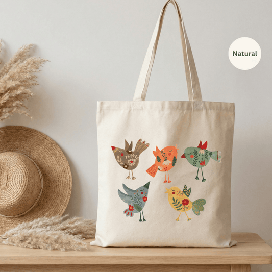 Natural canvas cotton tote bag with three folk art birds illustration in warm reds, teal and yellow