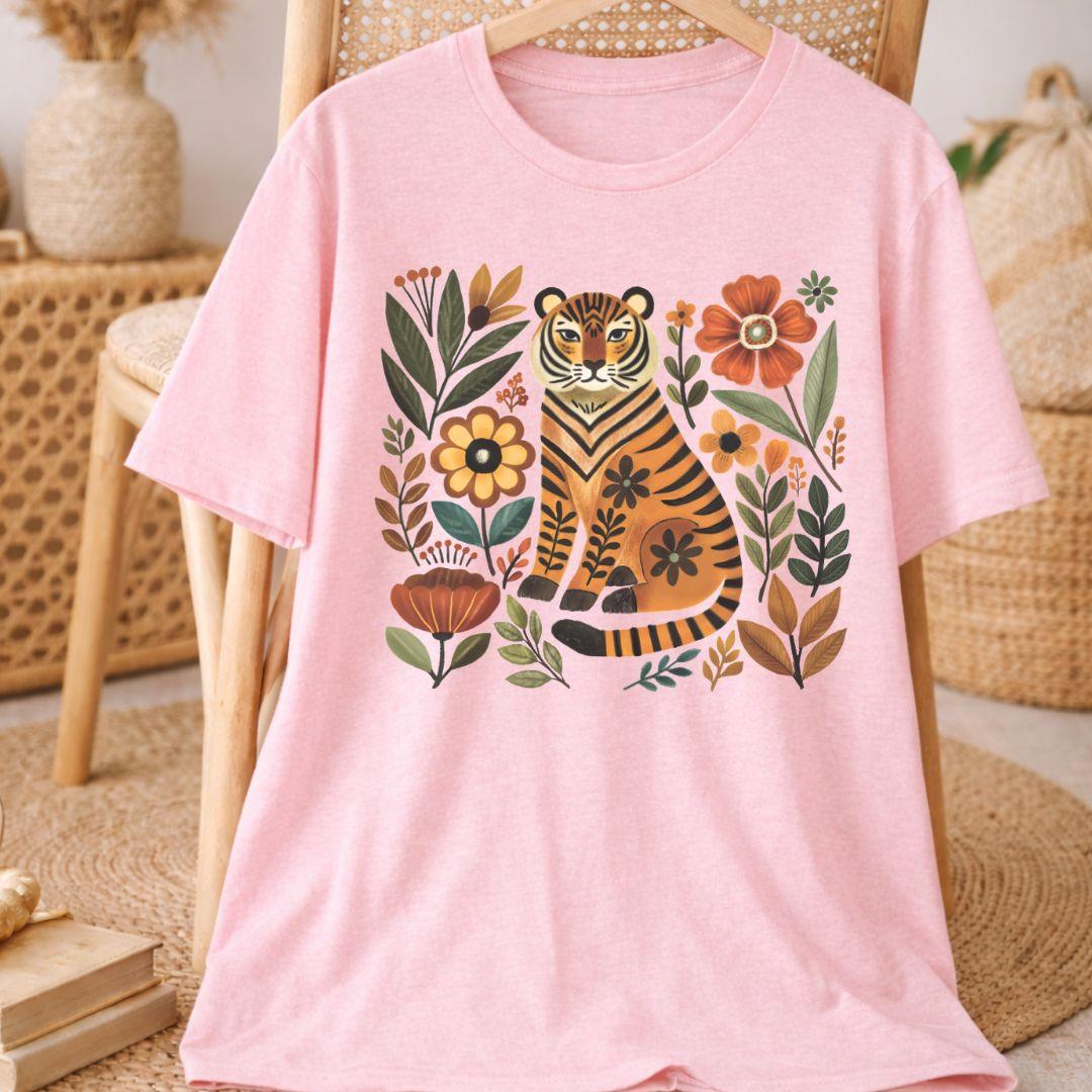 Pink Bella+Canvas 3001 tee with folk tiger and wildflower illustration, flat lay