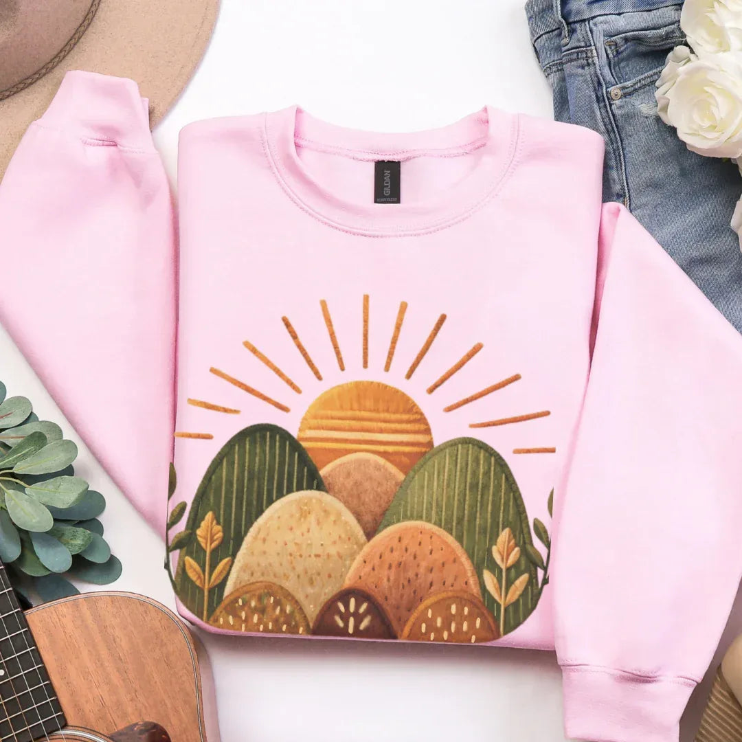 Sunrise Hills Crewneck Sweatshirt in Light Pink — folk art landscape crewneck