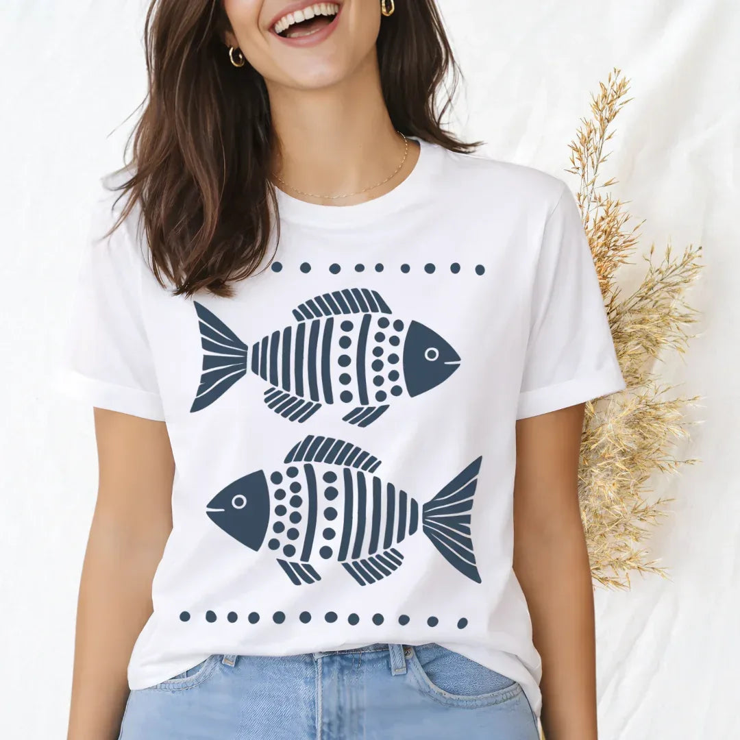 Two folk fish hand-painted folk art print on white cotton t-shirt — coastal graphic tee