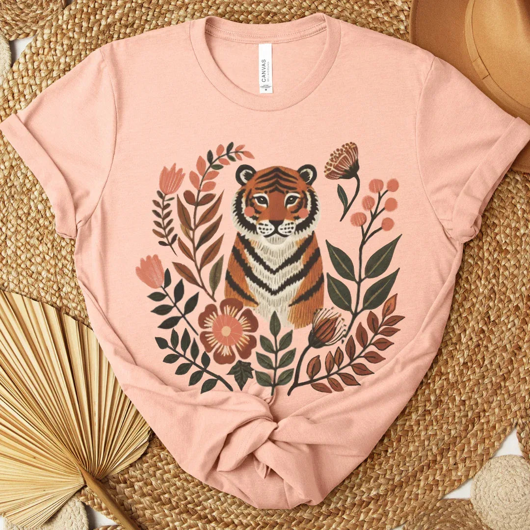 Vintage botanical tiger hand-painted folk art print on soft cotton peach tee — earthy floral tiger design