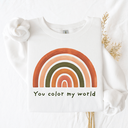 White Gildan 18000 sweatshirt with "You color my world" rainbow design, flat lay
